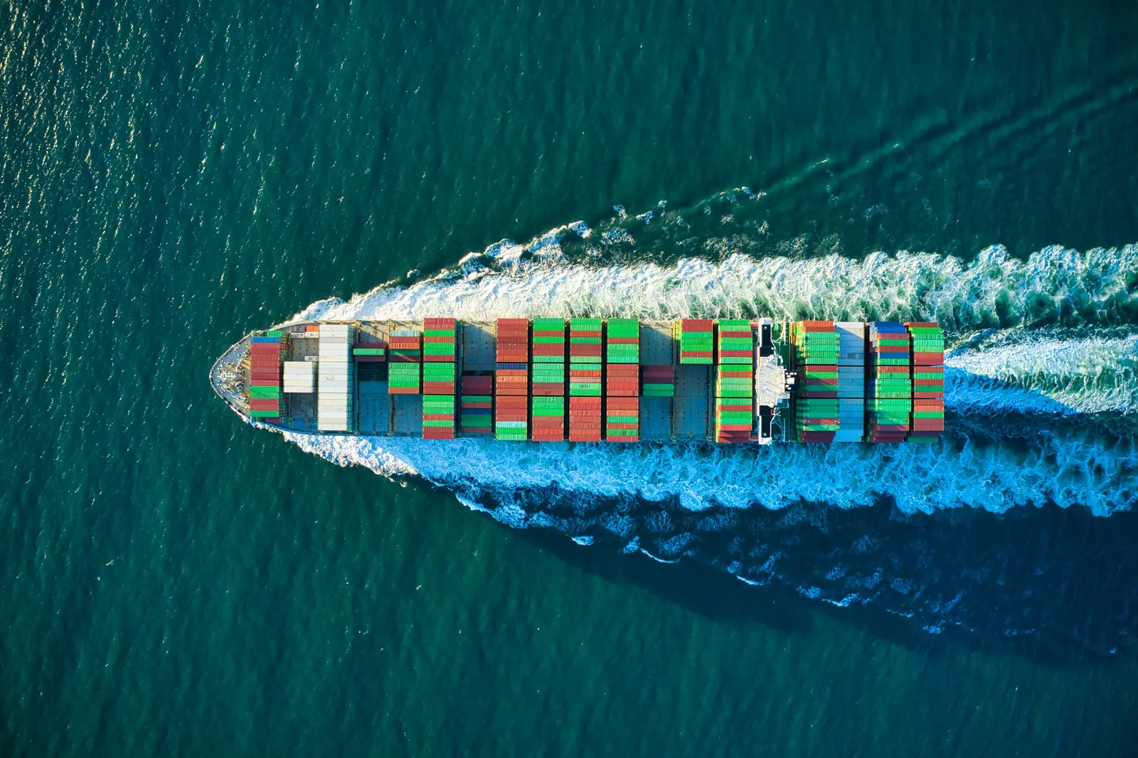 A container ship at sea, seen from above